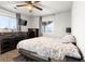 This bright bedroom features an inviting bed, sleek dressers, and great natural light from the windows at 3230 S Decatur St, Denver, CO 80236