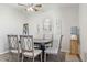 Dining area with modern table set, ceiling fan and decorative wall hangings at 3230 S Decatur St, Denver, CO 80236