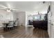Open floorplan shows dining area and living room with hardwood floors at 3230 S Decatur St, Denver, CO 80236