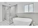 Bathroom features modern shower and tub at 26752 Vosler St, Conifer, CO 80433