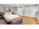 Bedroom with large window, hardwood floors, and closet doors at 26752 Vosler St, Conifer, CO 80433