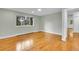 Bedroom with large window, hardwood floors, and closet doors at 26752 Vosler St, Conifer, CO 80433