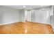 Bedroom with large window, hardwood floors, and closet doors at 26752 Vosler St, Conifer, CO 80433
