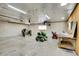 Interior view of a large two car garage used as a workshop, showing multiple tools and equipment at 26752 Vosler St, Conifer, CO 80433