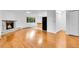 Bright living room features a stone fireplace, hardwood floors, and large windows at 26752 Vosler St, Conifer, CO 80433