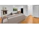 Bright living room features a stone fireplace, hardwood floors, and large windows at 26752 Vosler St, Conifer, CO 80433