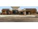 Welcoming clubhouse entrance with modern architecture and ample parking at 12881 Park Creek Way, Firestone, CO 80504