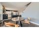 Bright dining area next to the kitchen with hardwood floors, bar stool seating, and an open concept feel at 12881 Park Creek Way, Firestone, CO 80504