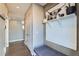 Inviting entryway with hardwood floors, bench seating, decorative shelving, and stylish accents at 12881 Park Creek Way, Firestone, CO 80504