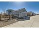 Detached one car garage, with neutral colored siding, fenced in yard, and alley access at 12881 Park Creek Way, Firestone, CO 80504