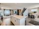 Spacious kitchen island boasts plenty of prep space and storage with modern cabinetry and open floorplan at 12881 Park Creek Way, Firestone, CO 80504