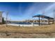 A covered pool area sits awaiting summer fun at 12881 Park Creek Way, Firestone, CO 80504