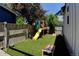 Fenced backyard with artificial turf, playground, cornhole, and soccer net at 1362 Golden Eagle Way, Louisville, CO 80027