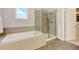 Bright bathroom features a soaking tub and a separate glass shower at 1362 Golden Eagle Way, Louisville, CO 80027
