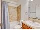 Well-maintained bathroom with a shower over the tub and tiled backsplash at 1362 Golden Eagle Way, Louisville, CO 80027
