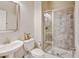 Bright bathroom with a glass-enclosed shower, modern fixtures and tile flooring at 1362 Golden Eagle Way, Louisville, CO 80027