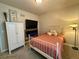 Comfortable bedroom featuring ample storage and a flat-screen TV at 1362 Golden Eagle Way, Louisville, CO 80027