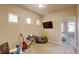 Cozy bedroom setup with entertainment equipment and natural light at 1362 Golden Eagle Way, Louisville, CO 80027
