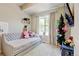 Cozy bedroom featuring a daybed, window with natural light and cheerful decor at 1362 Golden Eagle Way, Louisville, CO 80027