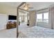 Spacious bedroom suite featuring a four-poster bed and seating area with abundant natural light at 1362 Golden Eagle Way, Louisville, CO 80027