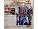 Walk-in closet with custom shelving and ample storage space for organization at 1362 Golden Eagle Way, Louisville, CO 80027
