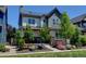 Stylish two-story home with a covered porch, stone accents, and a well-manicured front yard at 1362 Golden Eagle Way, Louisville, CO 80027