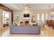Spacious living room with hardwood floors, fireplace, and seamless transition to the dining area at 1362 Golden Eagle Way, Louisville, CO 80027