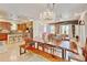 Spacious living and dining area featuring hardwood floors and open layout to kitchen at 1362 Golden Eagle Way, Louisville, CO 80027