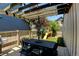 Backyard patio with a dining table, umbrella, and a playset at 1362 Golden Eagle Way, Louisville, CO 80027