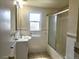 Traditional bathroom with tiled walls, a vanity, and a shower-tub combination at 7331 Clay St, Westminster, CO 80030