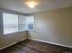 Bright bedroom with wood-look flooring and natural light at 7331 Clay St, Westminster, CO 80030