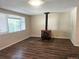 Cozy living room featuring wood-burning stove and bright natural light at 7331 Clay St, Westminster, CO 80030