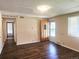 Inviting living room with wood-look floors, front door and hallway entrance at 7331 Clay St, Westminster, CO 80030