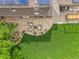Aerial view of a home with a patio, pergola, and a well-manicured lawn, highlighting outdoor living spaces and solar panels at 7030 S Fillmore Ct, Centennial, CO 80122