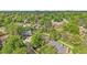 Overhead view of neighborhood with lush trees surrounding well-maintained homes at 7030 S Fillmore Ct, Centennial, CO 80122