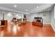 Finished basement features a large entertainment area, recessed lighting, and wood flooring at 7030 S Fillmore Ct, Centennial, CO 80122