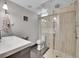 Modern bathroom with a sleek glass-enclosed shower and modern fixtures at 7030 S Fillmore Ct, Centennial, CO 80122