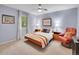 Relaxing bedroom with a cozy bed, a comfy chair, a ceiling fan, and a bright window at 7030 S Fillmore Ct, Centennial, CO 80122