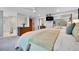 Bedroom with large mirror doors, dresser, and access to an attached bathroom at 7030 S Fillmore Ct, Centennial, CO 80122