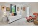 Comfortable bedroom with daybed, chair and outside access to backyard at 7030 S Fillmore Ct, Centennial, CO 80122