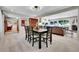 Elegant dining room with seating for six, flowing into the living room and office at 7030 S Fillmore Ct, Centennial, CO 80122
