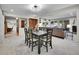 Open-concept dining area featuring a contemporary table set at 7030 S Fillmore Ct, Centennial, CO 80122