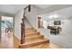 Entryway with hardwood floors leading to the stairway and dining area at 7030 S Fillmore Ct, Centennial, CO 80122
