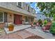 Spacious front porch with cozy seating, creating a warm and welcoming entrance to the home at 7030 S Fillmore Ct, Centennial, CO 80122