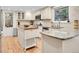 Modern kitchen with granite countertops, stainless steel appliances, a stylish backsplash, and a butcher block kitchen island at 7030 S Fillmore Ct, Centennial, CO 80122