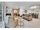 Cozy living room featuring a brick fireplace, comfortable seating, and built-in shelves at 7030 S Fillmore Ct, Centennial, CO 80122