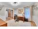 Bright office space with wood floors, desk, chair and doors at 7030 S Fillmore Ct, Centennial, CO 80122
