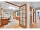 Bright office space with wood floors, desk, chair and doors at 7030 S Fillmore Ct, Centennial, CO 80122
