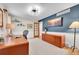 Home office with wood furnishings, blue accent wall, and modern lighting at 7030 S Fillmore Ct, Centennial, CO 80122