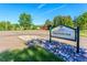 View of Cherry Knolls Park sign at entrance with surrounding trees and well-maintained landscape at 7030 S Fillmore Ct, Centennial, CO 80122